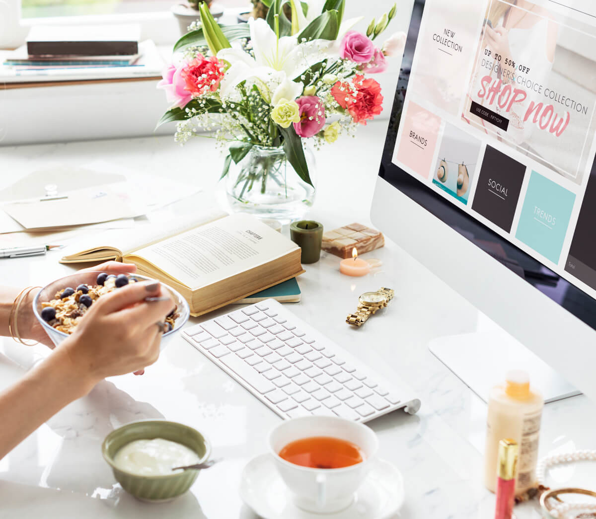 Girl eating food looking at shopping discounts online